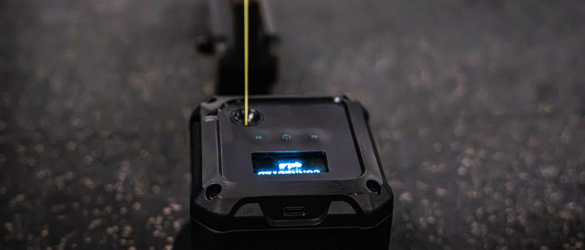 The velocity sensor on the floor, cord running up to the bar